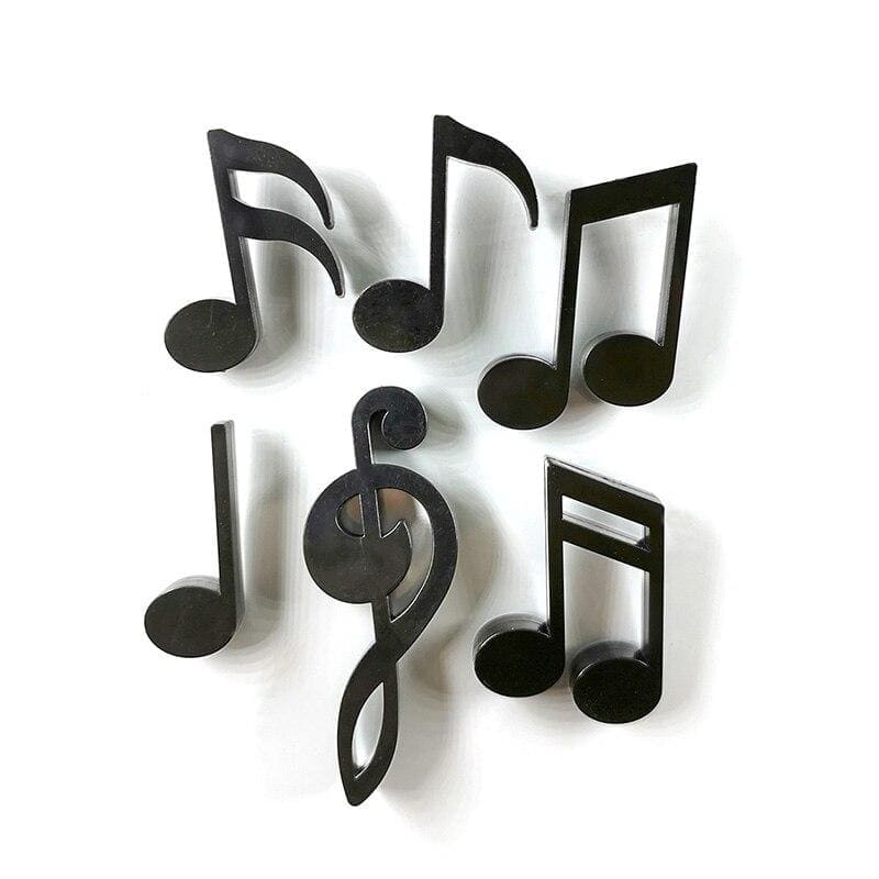 magnet frigo en forme de symboles musicaux noirs